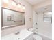 Bright bathroom featuring a tub-shower combination with white tile and a modern sink and mirror at 810 Sylvia Dr, Deltona, FL 32725