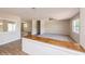 Bright living room with new carpet, and wood-look floors showcasing an open concept design at 810 Sylvia Dr, Deltona, FL 32725