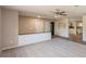 Open concept living room with new flooring and view of the kitchen at 810 Sylvia Dr, Deltona, FL 32725