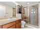 Bathroom featuring a glass-enclosed shower, and wood vanity at 8832 Ribault Ave, Orlando, FL 32832
