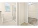 Bathroom with a glass shower, tile flooring, and a walk-in closet nearby at 8832 Ribault Ave, Orlando, FL 32832