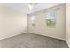 Sunny bedroom boasts neutral walls, carpet, and great natural light at 8832 Ribault Ave, Orlando, FL 32832