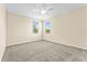 Spacious bedroom featuring neutral walls, plush carpeting, and lots of natural light at 8832 Ribault Ave, Orlando, FL 32832