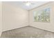 Neutral bedroom with natural light, wall-to-wall carpet and a ceiling fan at 8832 Ribault Ave, Orlando, FL 32832