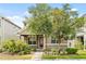 Charming two-story home featuring a landscaped front yard and a welcoming entrance at 8832 Ribault Ave, Orlando, FL 32832