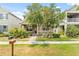 Charming two-story home with well-manicured landscaping and inviting curb appeal on a sunny day at 8832 Ribault Ave, Orlando, FL 32832