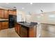 Stylish kitchen island with sink and breakfast bar, open to the living area at 8832 Ribault Ave, Orlando, FL 32832