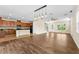Open-concept living room with hardwood floors, recessed lighting, and a ceiling fan at 8832 Ribault Ave, Orlando, FL 32832