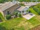 Aerial view of property featuring backyard with patio and lush greenery at 907 Silver Leaf Pl, Port Orange, FL 32127