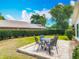 Beautifully landscaped backyard with a patio and mature hedges at 907 Silver Leaf Pl, Port Orange, FL 32127