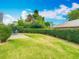 Lush backyard featuring outdoor patio and manicured lawn at 907 Silver Leaf Pl, Port Orange, FL 32127