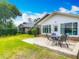 Backyard featuring a patio with outdoor seating and lush greenery at 907 Silver Leaf Pl, Port Orange, FL 32127