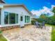 Backyard view of the home featuring a brick patio with outdoor seating at 907 Silver Leaf Pl, Port Orange, FL 32127