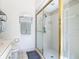 Walk-in shower with gold frame and towel rack in bathroom at 907 Silver Leaf Pl, Port Orange, FL 32127