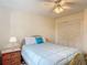 Bedroom featuring a brass bed frame, ceiling fan, and closet at 907 Silver Leaf Pl, Port Orange, FL 32127