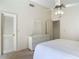 Bright bedroom features a ceiling fan, neutral carpeting, and a dresser at 907 Silver Leaf Pl, Port Orange, FL 32127