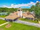 Exterior shot of the community clubhouse featuring a clock tower, American flag, and sign at 907 Silver Leaf Pl, Port Orange, FL 32127