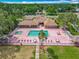 An aerial shot of the clubhouse, pool, shuffleboard, and lush landscaping that define this exceptional neighborhood at 907 Silver Leaf Pl, Port Orange, FL 32127