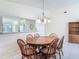 Inviting dining room featuring a wooden table set and view to the kitchen at 907 Silver Leaf Pl, Port Orange, FL 32127