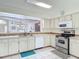 Bright kitchen with stainless appliances and a view through to the dining and living room at 907 Silver Leaf Pl, Port Orange, FL 32127