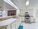 Well-lit kitchen with stainless steel appliances and a pass-through to the dining area at 907 Silver Leaf Pl, Port Orange, FL 32127