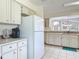 Spacious kitchen with white appliances, ample counter space, and coffee bar area at 907 Silver Leaf Pl, Port Orange, FL 32127