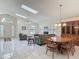 Open-concept living room filled with natural light from the skylights and large windows at 907 Silver Leaf Pl, Port Orange, FL 32127