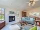 Inviting living room with tile floors, a fireplace, and comfortable furnishings at 907 Silver Leaf Pl, Port Orange, FL 32127