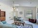 Bright and airy living room with high ceilings, tile floors, and large windows at 907 Silver Leaf Pl, Port Orange, FL 32127