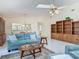 Open-concept living area with tile floors, natural light, and stylish decor at 907 Silver Leaf Pl, Port Orange, FL 32127