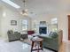 Cozy living room featuring a fireplace, tile flooring and comfortable seating arrangement at 907 Silver Leaf Pl, Port Orange, FL 32127