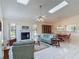 Spacious living room featuring tile floors, vaulted ceiling, and a cozy fireplace at 907 Silver Leaf Pl, Port Orange, FL 32127