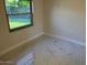 Bedroom view with window and tile floor at 908 Boulder Dr, South Daytona, FL 32119