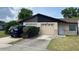 Charming single-story home featuring a one car garage, well-kept lawn, and tidy front landscaping at 908 Boulder Dr, South Daytona, FL 32119