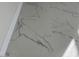 Close-up of the new marble flooring at 908 Boulder Dr, South Daytona, FL 32119