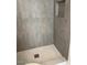 Updated shower features modern tiling and fixtures at 908 Boulder Dr, South Daytona, FL 32119