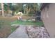 Backyard patio seating area with an outdoor table and chairs on the turf at 921 Valleydale Ave, Deland, FL 32720