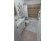 Well-lit bathroom featuring a shower-tub combo, white vanity, and stylish decorative accents at 921 Valleydale Ave, Deland, FL 32720