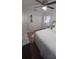 Bedroom with white bedding, a ceiling fan, and closet storage at 921 Valleydale Ave, Deland, FL 32720