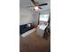 Bright room featuring a ceiling fan, work space, and comfortable seating area at 921 Valleydale Ave, Deland, FL 32720