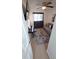 Bedroom featuring a sofa, piano, television, and shag rug in a neutral color scheme at 921 Valleydale Ave, Deland, FL 32720