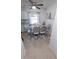 Elegant dining area featuring a glass-top table, stylish chairs, and modern decor for a sophisticated look at 921 Valleydale Ave, Deland, FL 32720