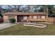 Inviting single-story home featuring well-maintained landscaping and a cozy front porch area at 921 Valleydale Ave, Deland, FL 32720