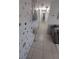 Inviting hallway with unique wall decor, leading to various rooms in the home at 921 Valleydale Ave, Deland, FL 32720