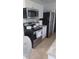 Bright kitchen with stainless steel appliances, tile floors, and stone countertops at 921 Valleydale Ave, Deland, FL 32720