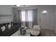Comfortable living area with a sectional sofa, stylish decor, and ample natural light at 921 Valleydale Ave, Deland, FL 32720
