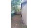 Side yard featuring a wooden access gate at 921 Valleydale Ave, Deland, FL 32720