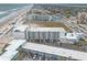 Aerial view showcases oceanfront condos, nearby parking, beach access, and scenic coastal views at 935 S Atlantic Ave # 363, Daytona Beach, FL 32118