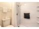 This bathroom features a new walk in shower and toilet with tiled floors at 935 S Atlantic Ave # 363, Daytona Beach, FL 32118