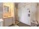 This bathroom features a white vanity and toilet with tiled floors at 935 S Atlantic Ave # 363, Daytona Beach, FL 32118